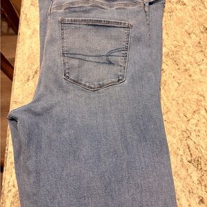 American Eagle Ripped Super High Wasted Flare Light Blue Jeans